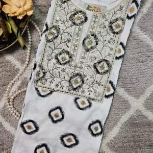 white color kurthi with embroidery work on the yoke part