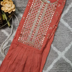 Orange color Ghera kurthi withembroidery work on the yoke part