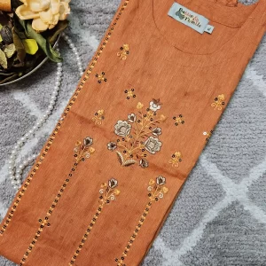 Orange colour kurthi with thread embroidery on the yoke part